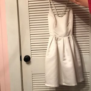 Spaghetti strap white dress. Open back